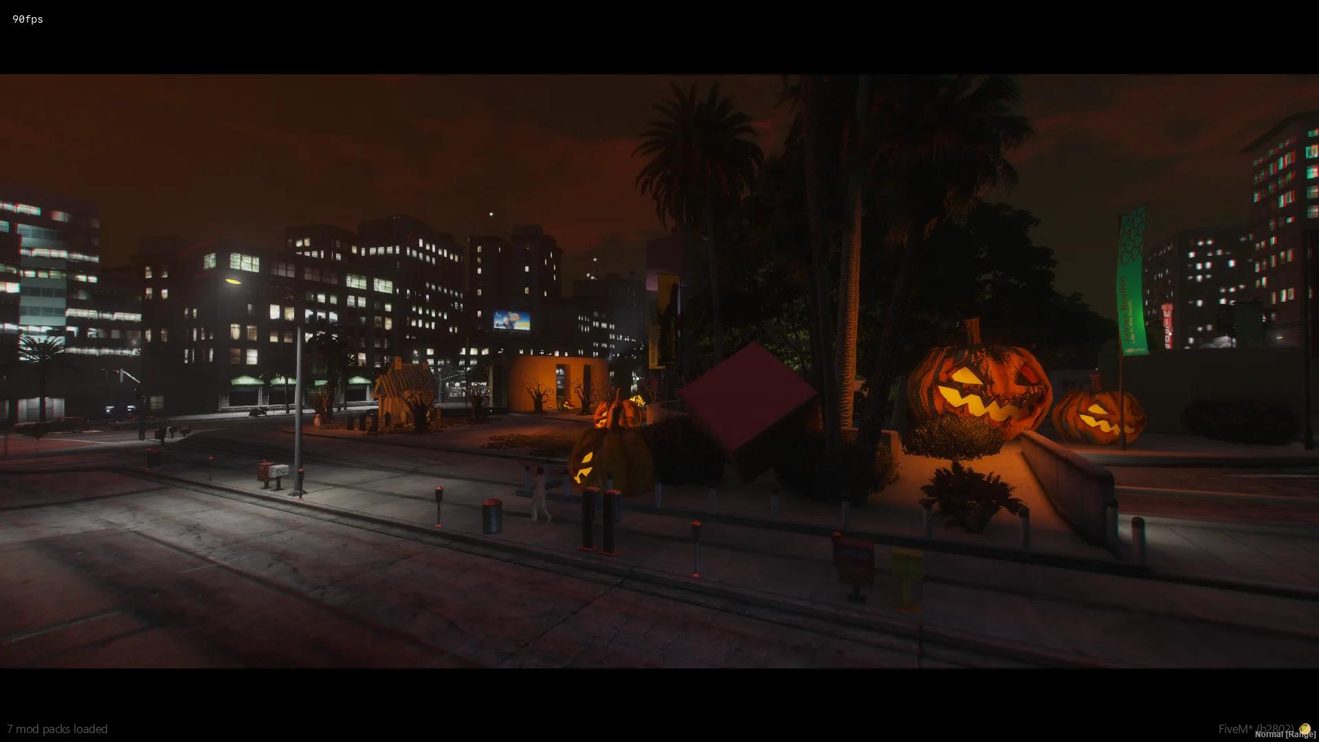 Legion Square park lit by giant jack-o'-lanterns under an orange night sky