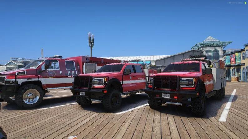 Heavy rescue truck and two red brush pickups from the EMS pack